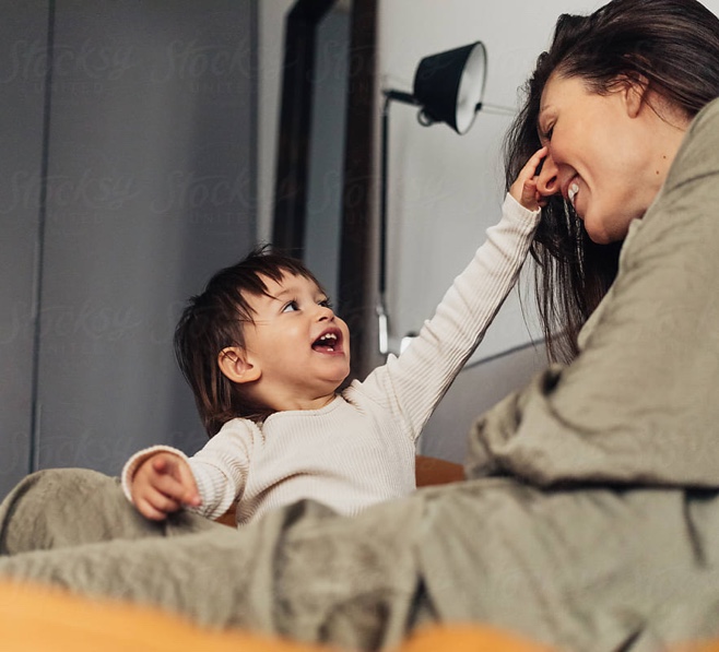 smiling kid with mother