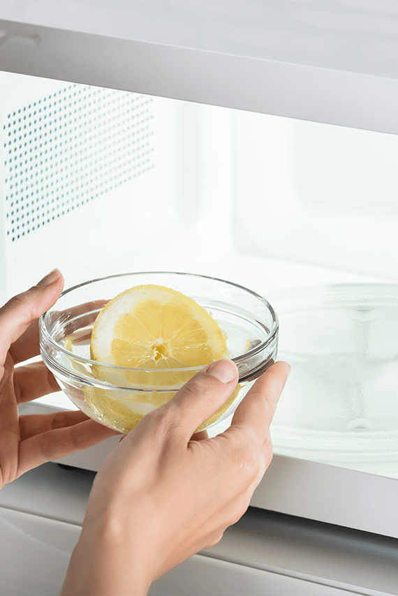 bowl mixed with water and lime used for cleaning microwave