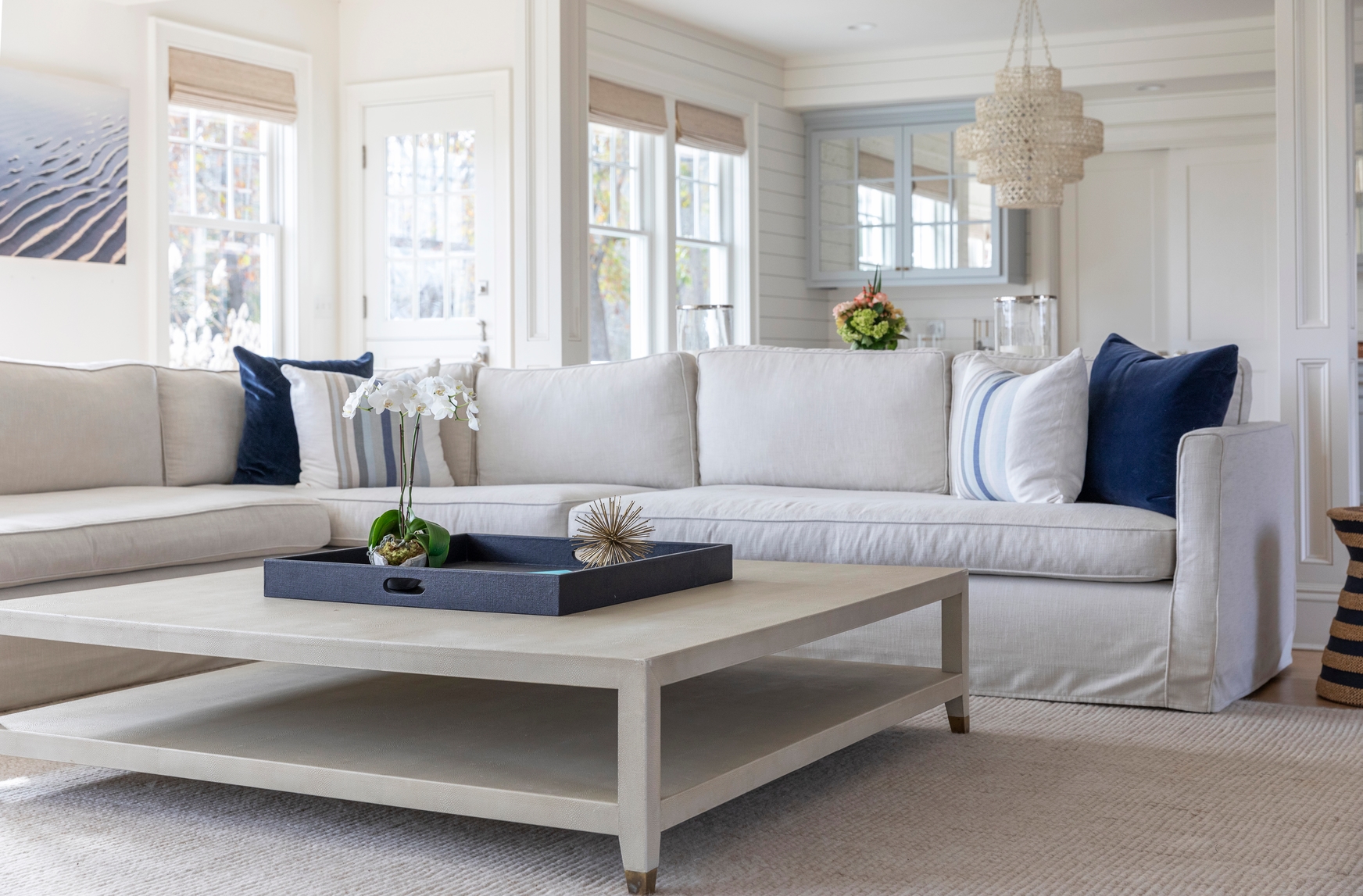 clean living room with sectional and carpet