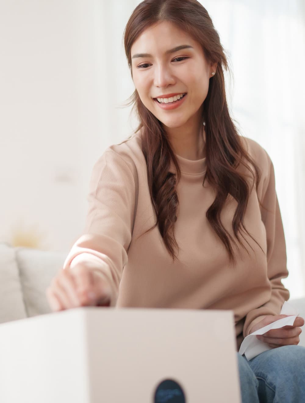 woman turning on a smart air purifier