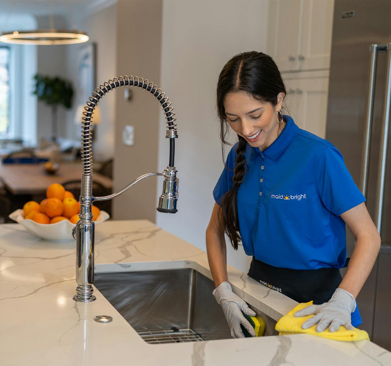 Maid-Bright-Professional-House-Cleaning-Service-Recurring-Cleaning-Peace-Of-Mind-Woman-Cleaning-Sink