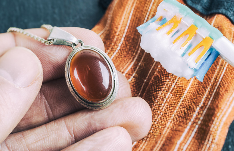 cleaning silver with a brush